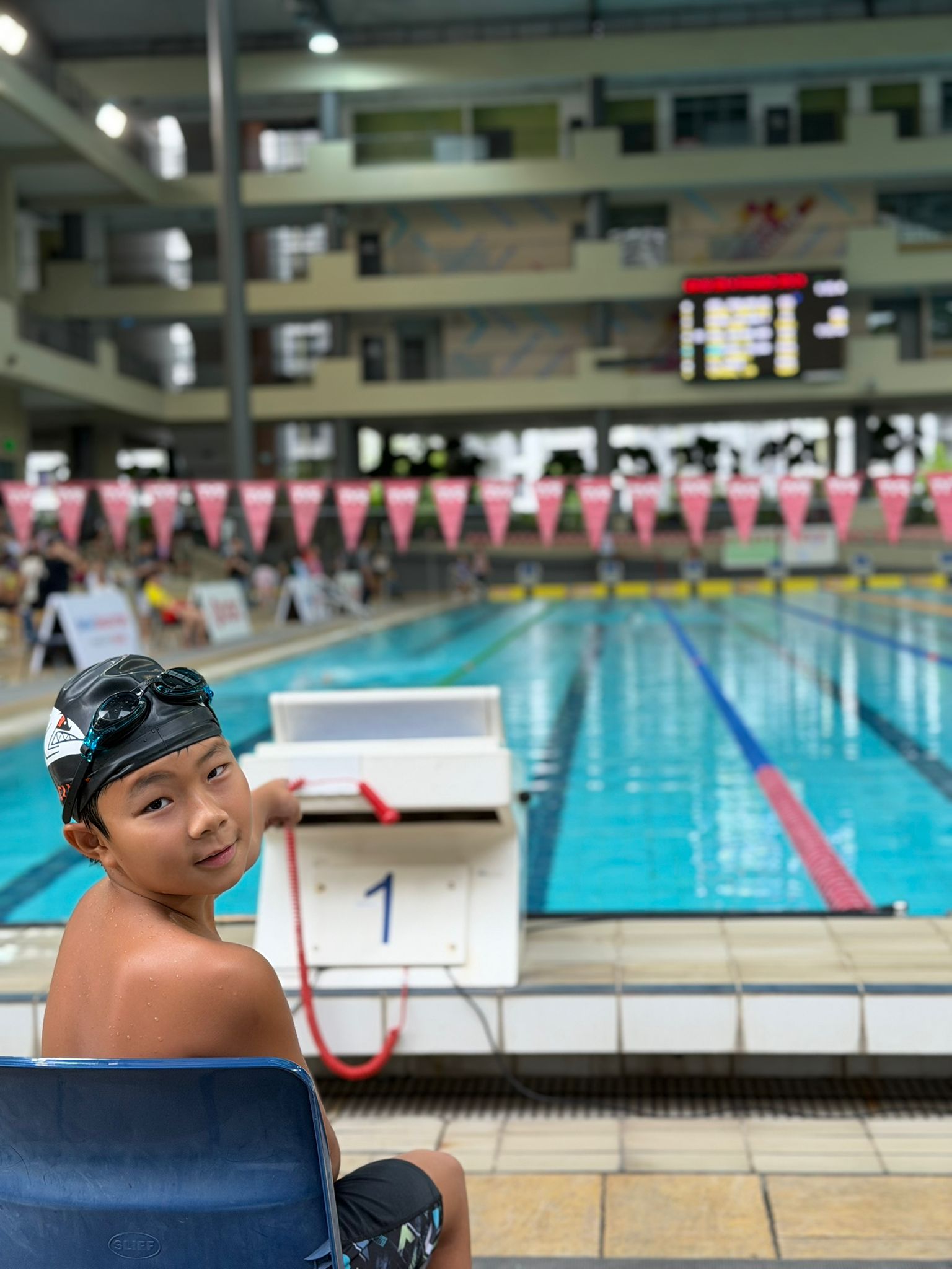 Evan Liew poolside at Lane 1, competition-ready at Pesta Sukan 2026